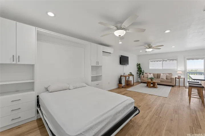 Second-floor living area featuring a convenient pull-out bed with built-in storage, offering flexible space for overnight guests.
