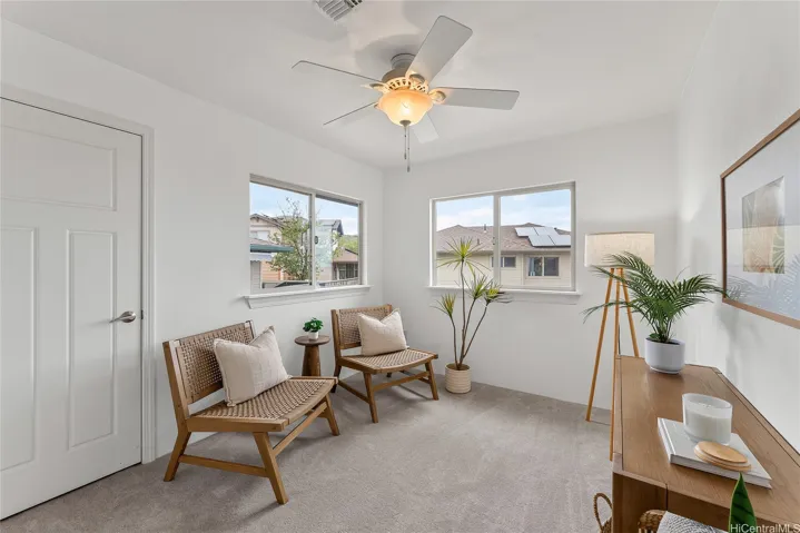 Second-floor sitting area offering a cozy space to relax and unwind.