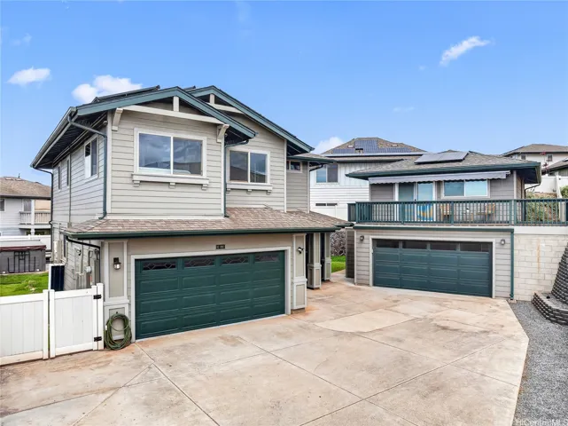 Welcome to this beautiful two-story home featuring an attached garage and spacious driveway.
