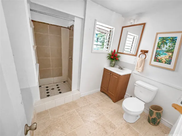 Enhanced- Bathroom pic of front (2nd) structure. Flooring is painted, not tiled.