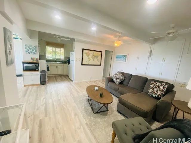 Bonus room downstairs looking into a small wetbar area
