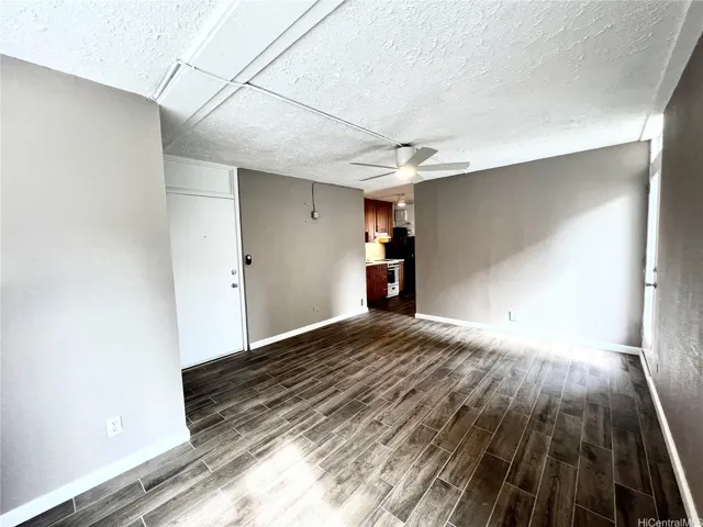 Living room with lanai access (front door in photo)