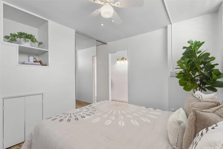 BEDROOM W/ CEILING FAN & BUILT-IN SHELVING