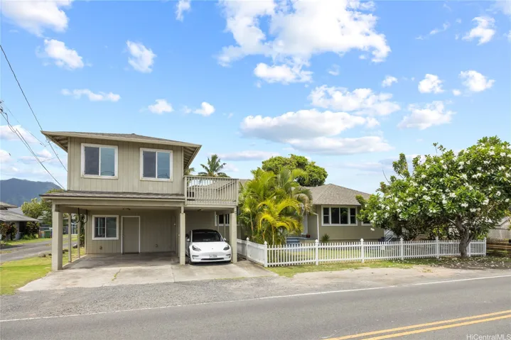This property has flexibility! There is a primary en suite two-story unit on the left and a main house with 4 bedrooms and two baths.  There is carport and street parking available. And, the property is a mere .5 miles from Kalama Beach Park.