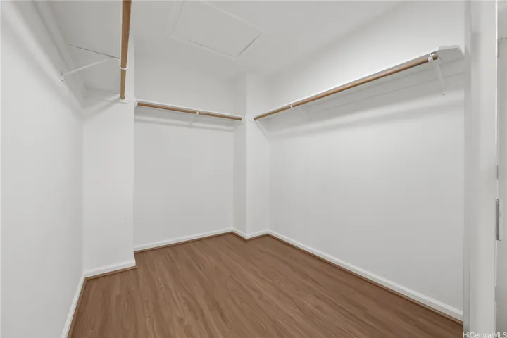 Primary bedroom walk in closet