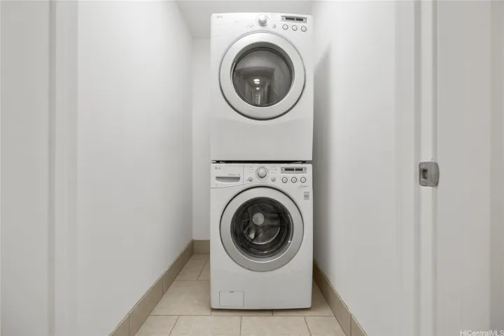 Stacked front load washer and dryer in laundry closet