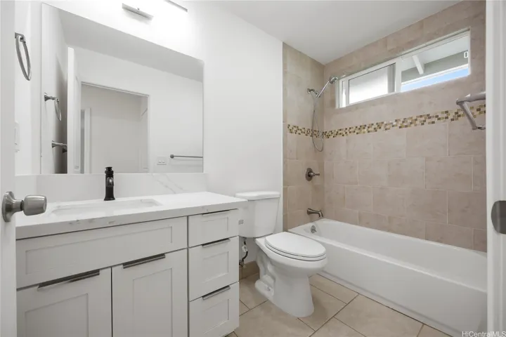 Second level full bath with tiled shower surrounds and new vanity & lighting