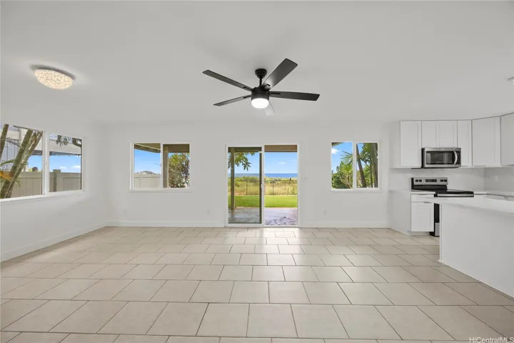 Lower level living area with open kitchen design which flows to your covered lanai