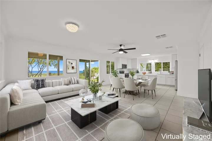 Lower level living area with open kitchen design which flows to your covered lanai