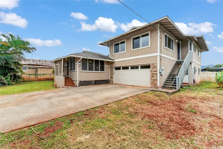 Front of home with tons of parking and two car garage (laundry hook ups in garage)