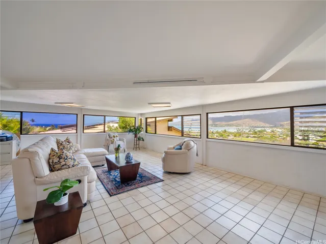 lower ceilings in the family room, tile floors, large room.
