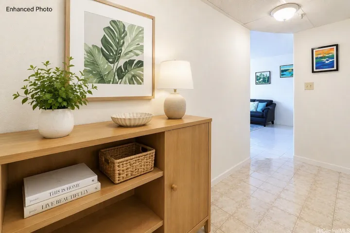 An immaculately maintained 3 bedroom, 2 bath, 2 parking, & enclosed lanai unit