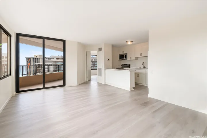 Bright, airy living area — fresh paint, new flooring, completely updated
