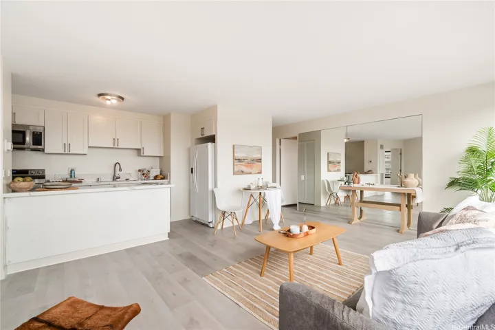 Virtually staged living and dining area — generous square footage with room to make it your own