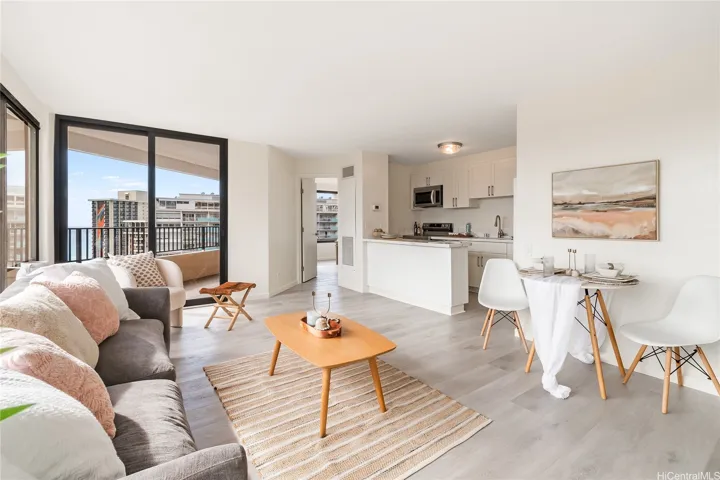 Light-filled living room with floor-to-ceiling windows and fresh finishes throughout