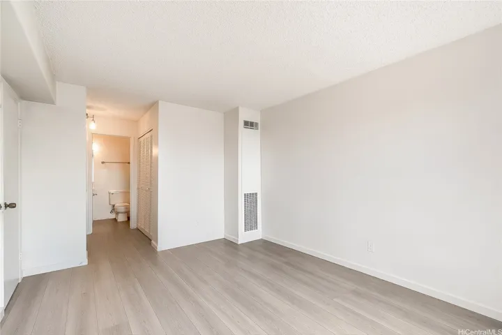 Clean, light-filled secondary bedroom — move-in ready
