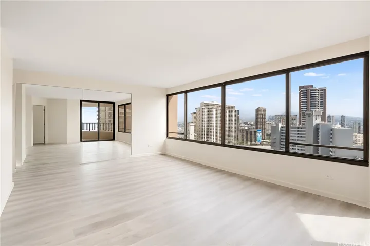Expansive windows frame the Honolulu skyline from every angle