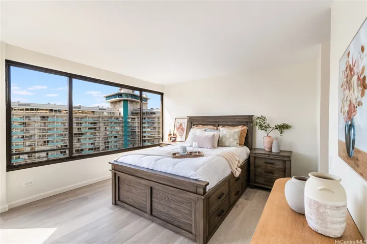 Virtually staged primary bedroom — generous size with beautiful natural light