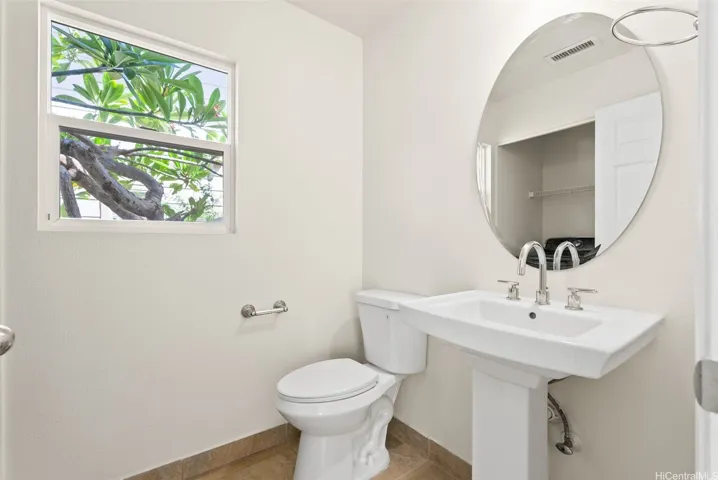 Half bath on the main level near the living room and entry.