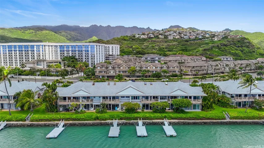 Marina-front setting with boat docks nearby (This residence does not include a boat dock. Dock rental opportunities may be available from neighboring owners, subject to availability and any applicable association requirements. Buyers are encouraged to independently verify.)