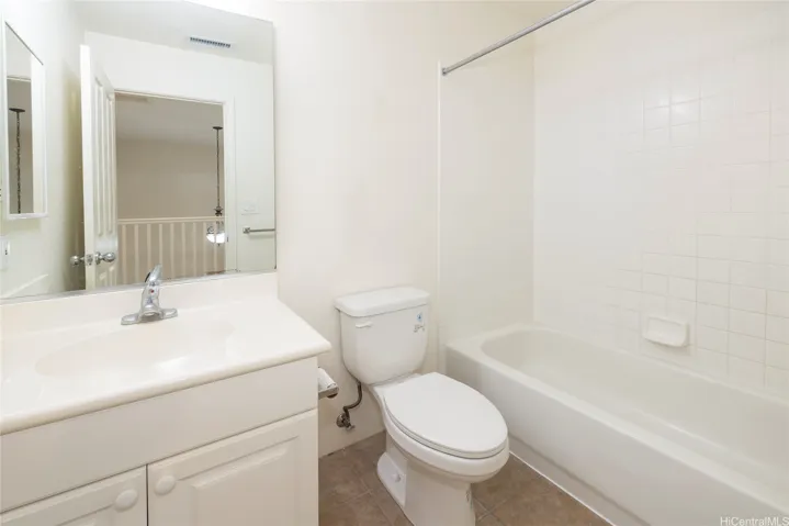 Full bathroom upstairs with tub