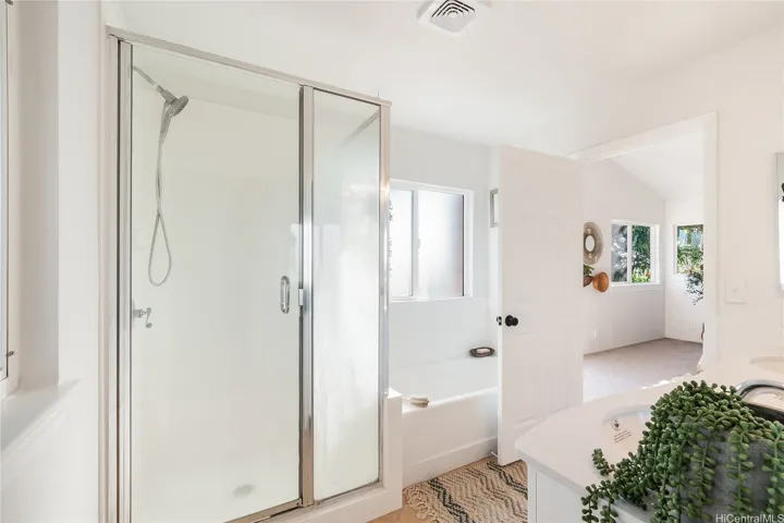 Let the water rain on you or soak in this deep tub enjoying the peace of island life.