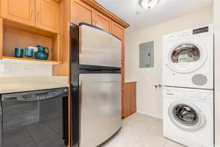 Washer and dryer in the unit conveniently tucked away from the kitchen.