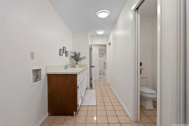 Interior laundry area with full bathroom.