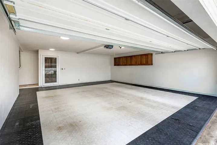 Spacious 2-car garage with driveway that can accommodate additional parking.