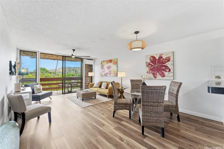 Open concept living and dining space opening to the lanai