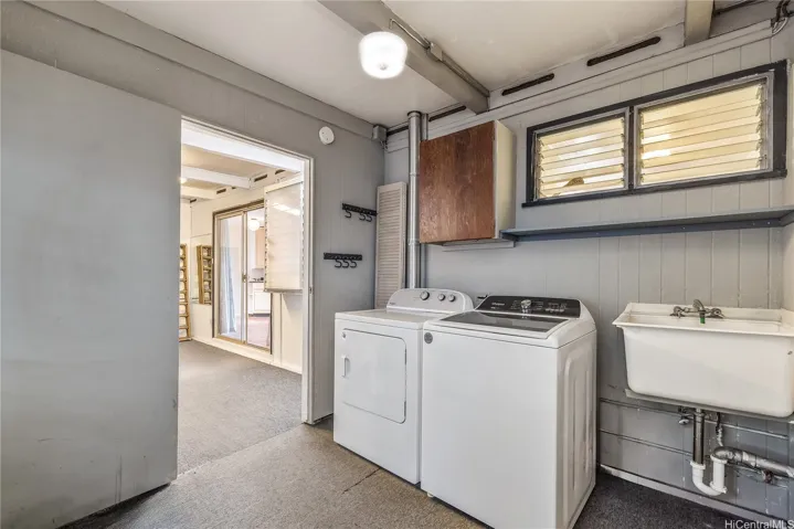 Laundry area for main part of the home with sink.