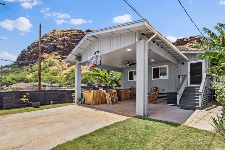High roofed carport with room for a boat/trailer and at least 2 other vehicles. No maintenance or association fee!