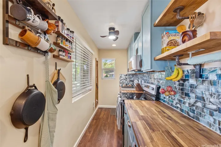 Super efficient kitchen has natural light, custom butcher block counter tops and all the appliances you need. Plenty of storage makes time in the kitchen a breeze! Fantastic color theme throughout the home.