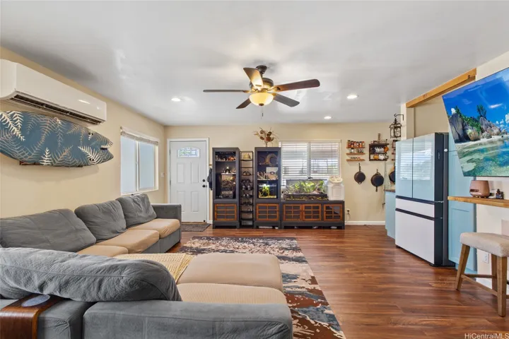 Coming back into the living room you'll notice space for storage and a bar top for dining or work.