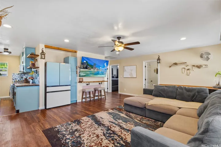 Entry leads to a spacious living room with massive TV (negotiable) and brand new fridge.