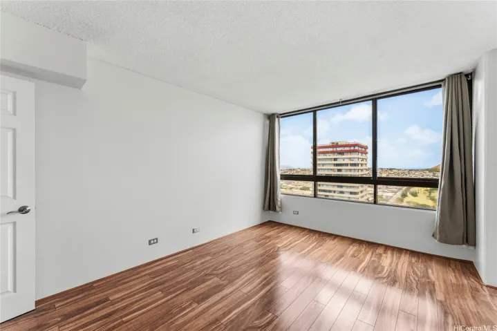 Primary bedroom is bright with another stunning view from the 37th floor.