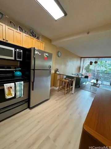 Enhanced. Kitchen viewing living room