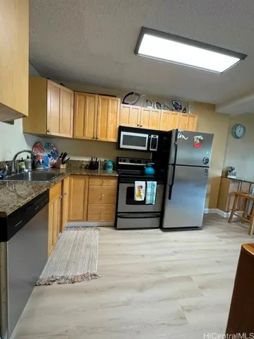 Enhanced. Kitchen as seen from entry way hall