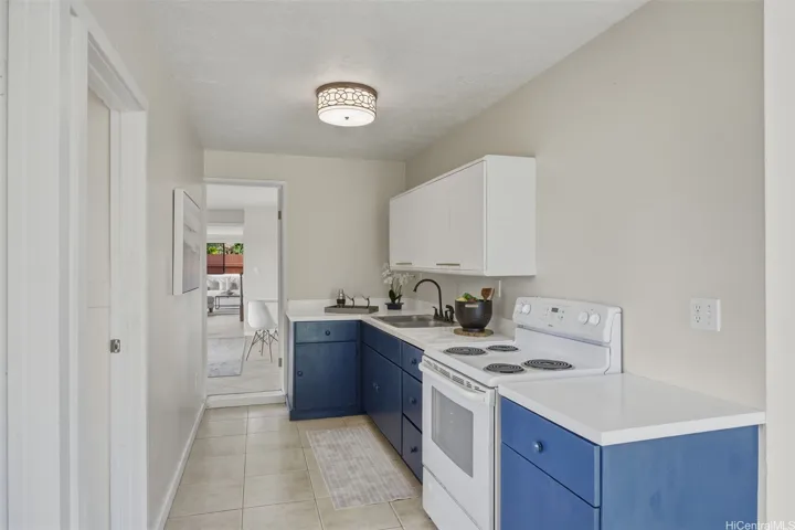 The wet bar in the 2-bedroom 1-bath bonus space that is great for multi-gen/extended family living, home office, or rental. The doorway in the center of the photo leads to den/4th bedroom of the main house and can be closed to separate the spaces.