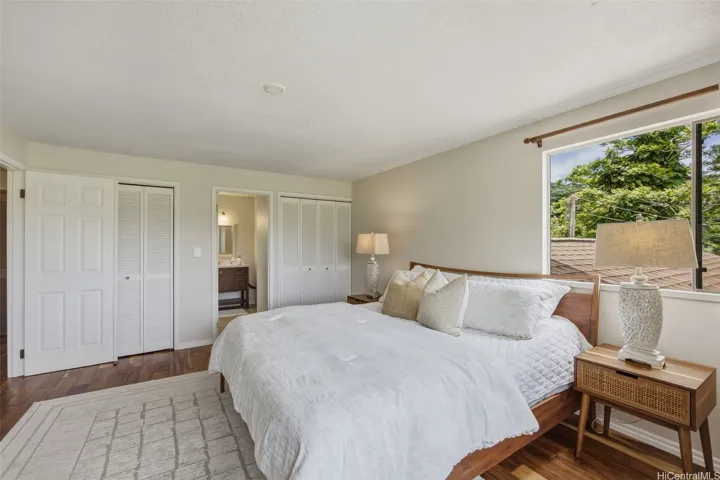 The primary suite features two large closets with the primary ensuite through the doorway in the center of the
photo.