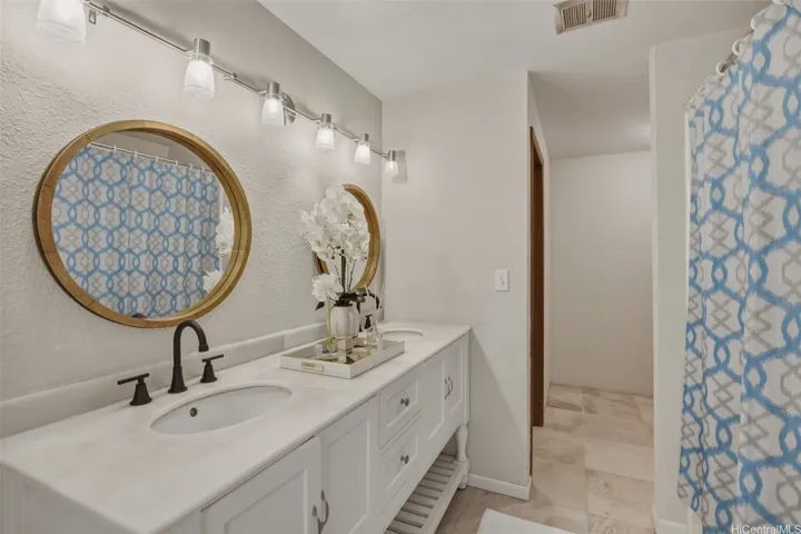 Second upstairs bathroom has been updated and includes two large storage/closet spaces. Beautiful as it is and has potential to be converted to a spa-style experience or just keep the two storage/closet spaces as they are.
