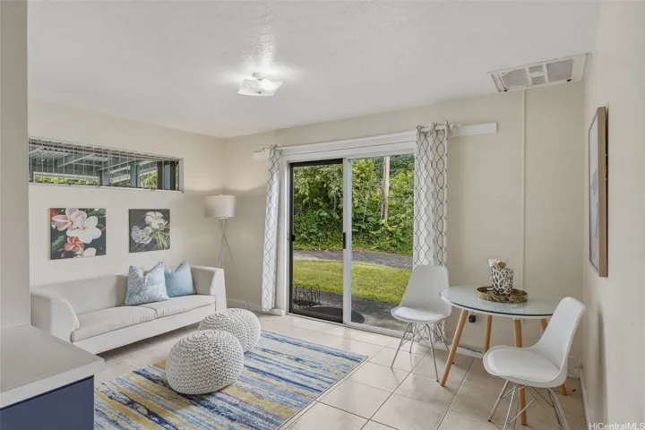 Living room and dining area of the bonus space. The sliding door is the private exterior entry if the space is locked off from the den/4th bedroom of the main home.
