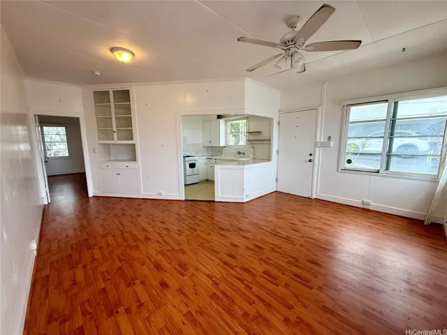 Inviting living area with a functional layout connecting seamlessly to the kitchen and bedroom.