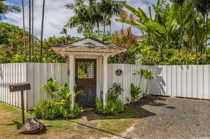 Architect-deisgned gate w/Garden of Eden just beyond, fully fenced, two add'l guest parking.