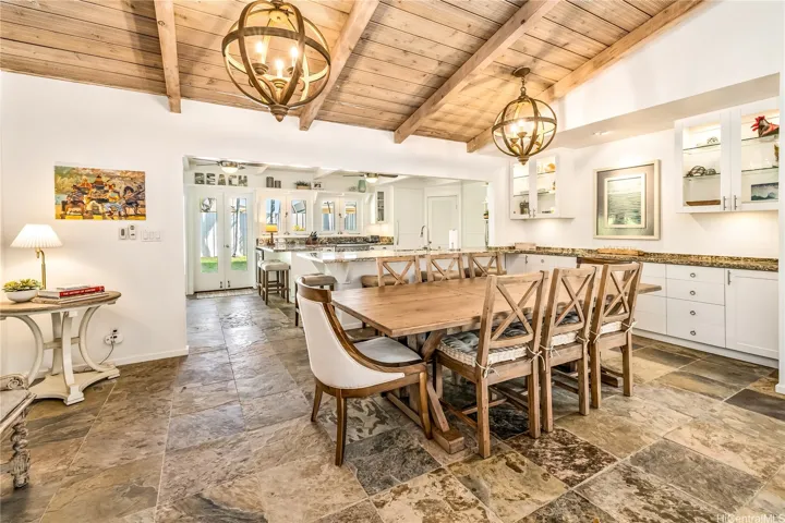 Dining area built-ins with art wall centrally located between the kitchen and living room.