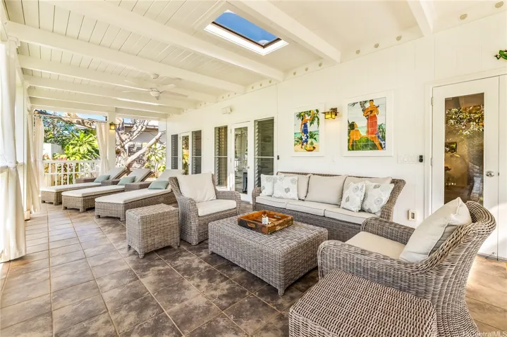 Generous-sized front lanai ideal for intimate or large gatherings.