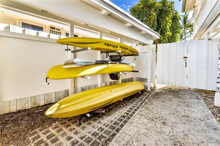 Back area for kayaks and beach toys w/easy access to the beach. Private covered outdoor hot/cold shower nearby.