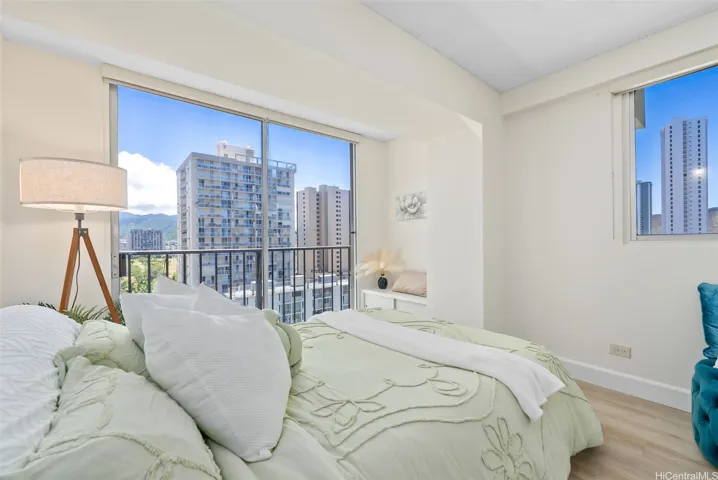 Large bedroom with floor to ceiling mountain/city views - only available in corner units!