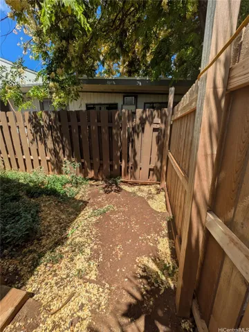 Just inside the gate of the backyard