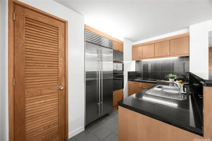 Sub-Zero refrigerator and original Gaggenau appliances.